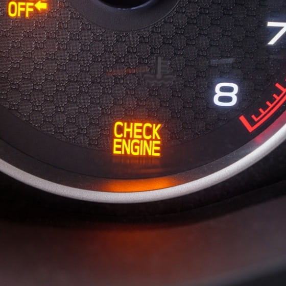 Check Engine warning light illuminated on vehicle dashboard.