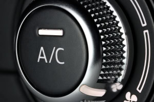 A/C control knob in a vehicle's climate system, highlighting automotive air conditioning repair and.