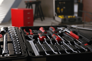 Professional automotive tool set with screwdrivers and wrenches for vehicle repairs.