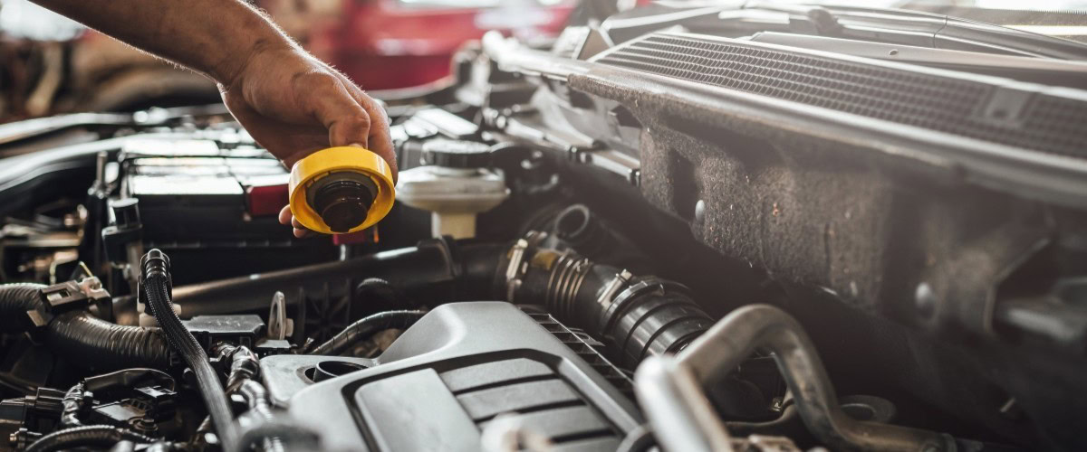 Car engine being checked during routine maintenance at Butterworth's Service Centre.