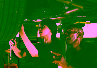 mechanic-female-trainee-working-underneath-car