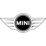 Mini Cooper parked outside Car Corral Garage, showcasing quality vehicle service.
