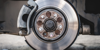 Brake rotor and caliper assembly during repair process.