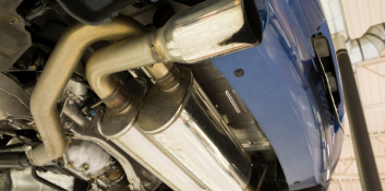 Exhaust system repair in progress at Car Corral Garage, ensuring optimal vehicle performance and emi.