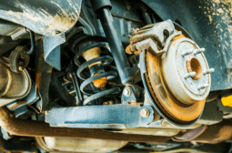 Vehicle suspension system being repaired at Car Corral Garage.