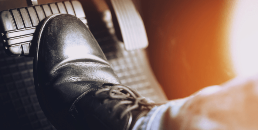 Brake pedal and foot on car pedal, vehicle maintenance concept.