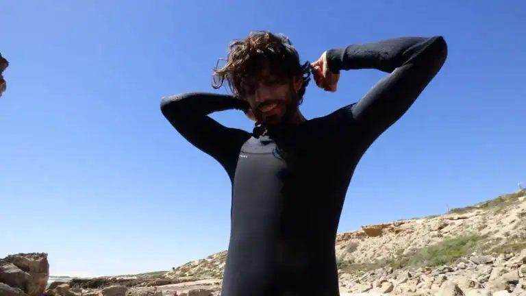 putting on a wetsuit in australia