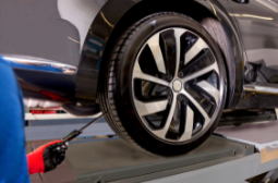 Professional car wheel inspection and maintenance at Clay’s Auto.