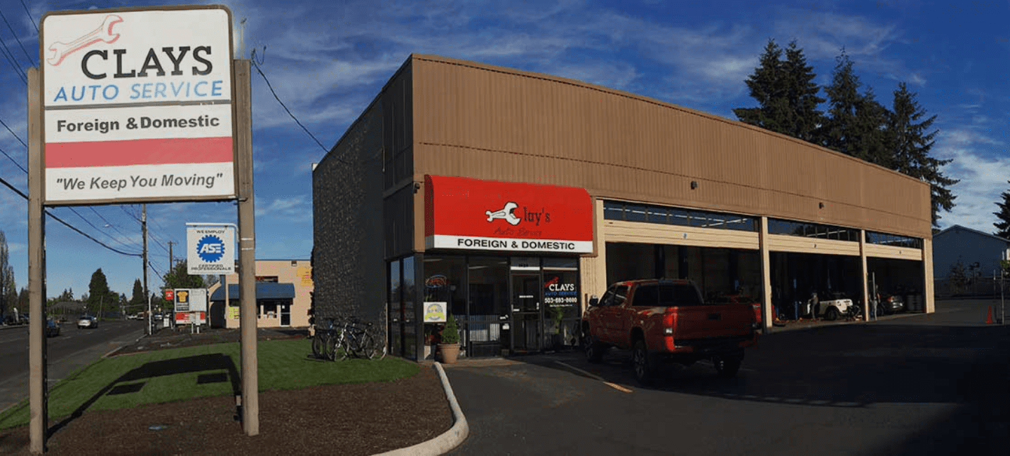Auto repair shop with service bays and signage for Clay's Auto Service.