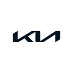 Close-up of Kia emblem on vehicle front grille.