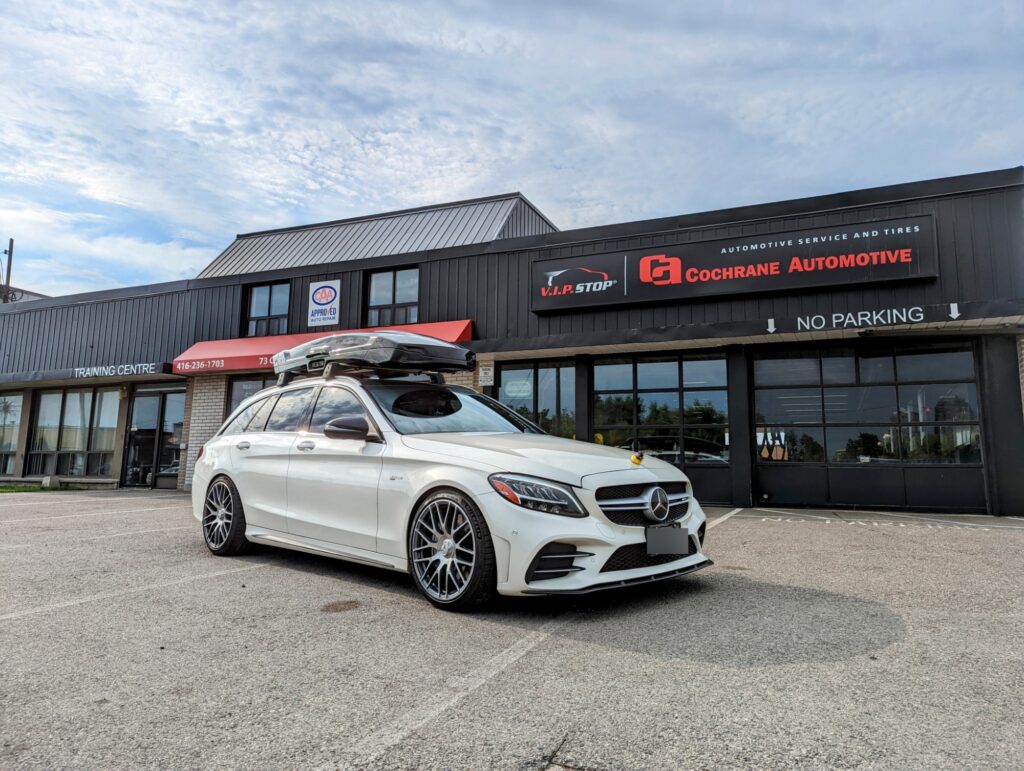 Cochrane Automotive dealership with a Mercedes-Benz parked outside.