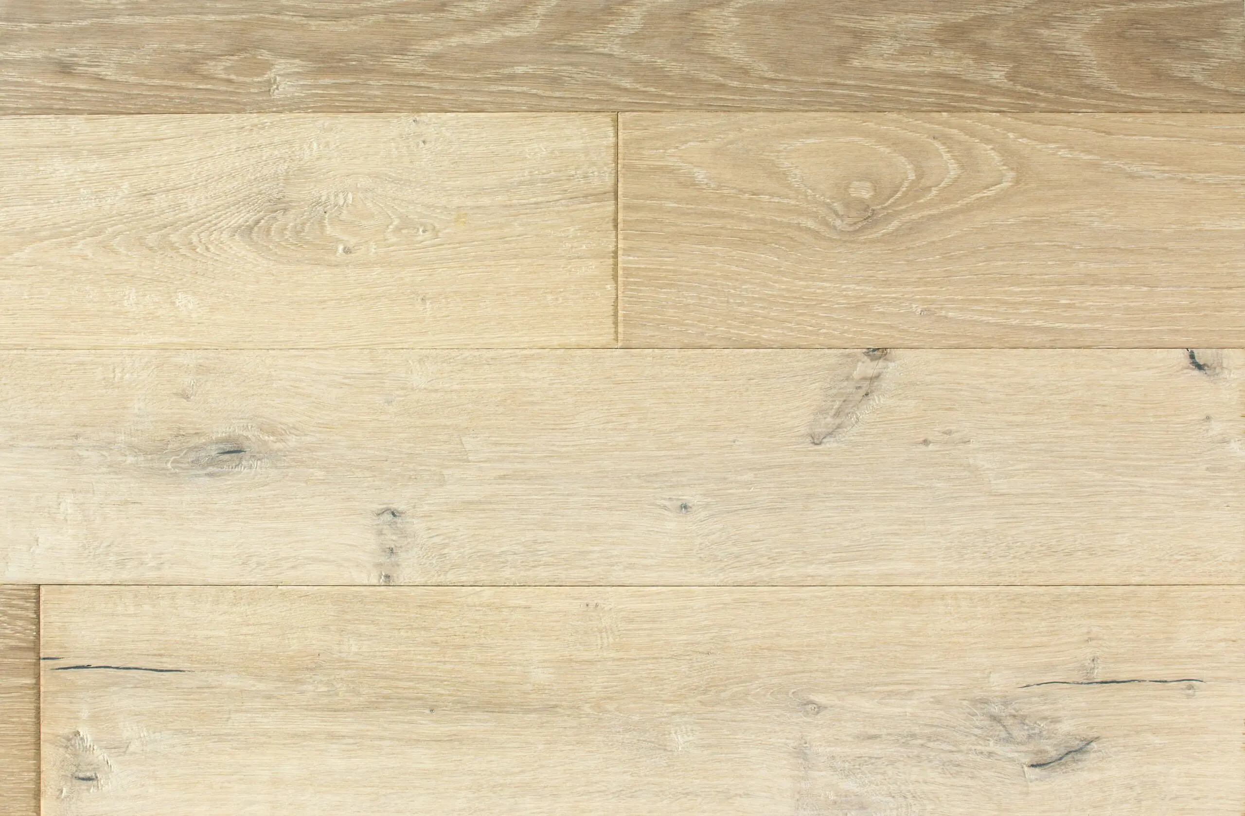 Smooth light oak hardwood flooring.