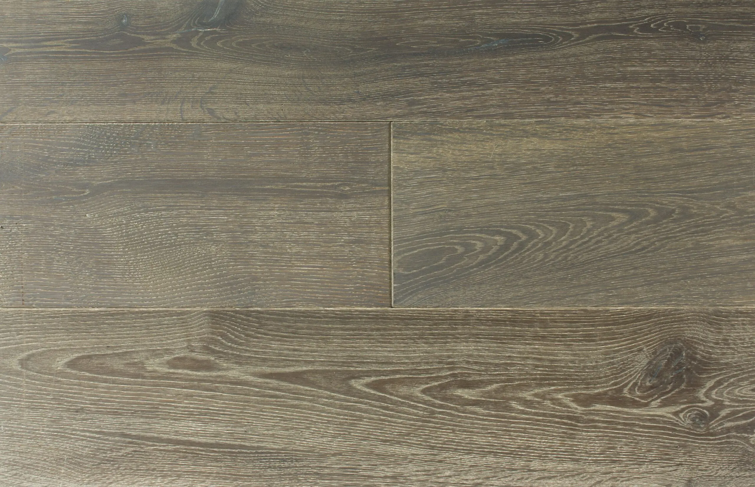 Smooth gray wood flooring with natural grain for modern interior design.