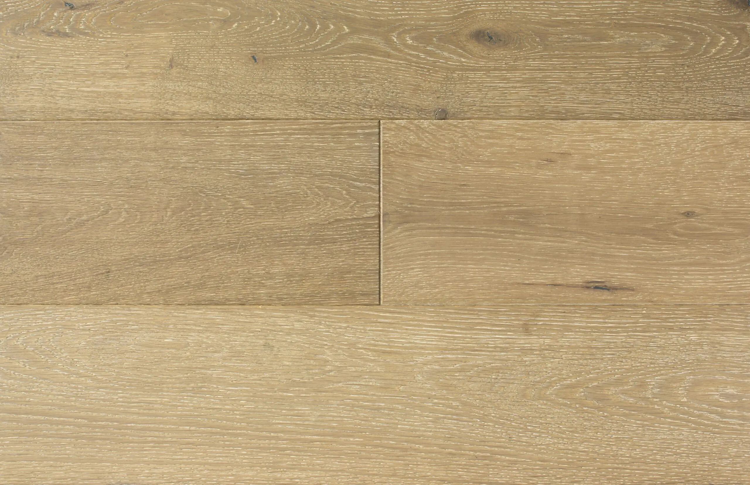 Smooth natural oak hardwood flooring with a polished finish, ideal for residential and commercial spaces.