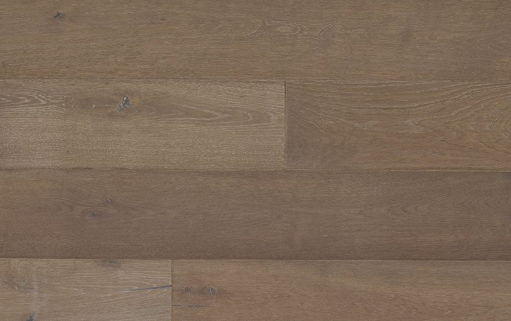 Natural hardwood flooring in warm brown tones for home interior enhancement.