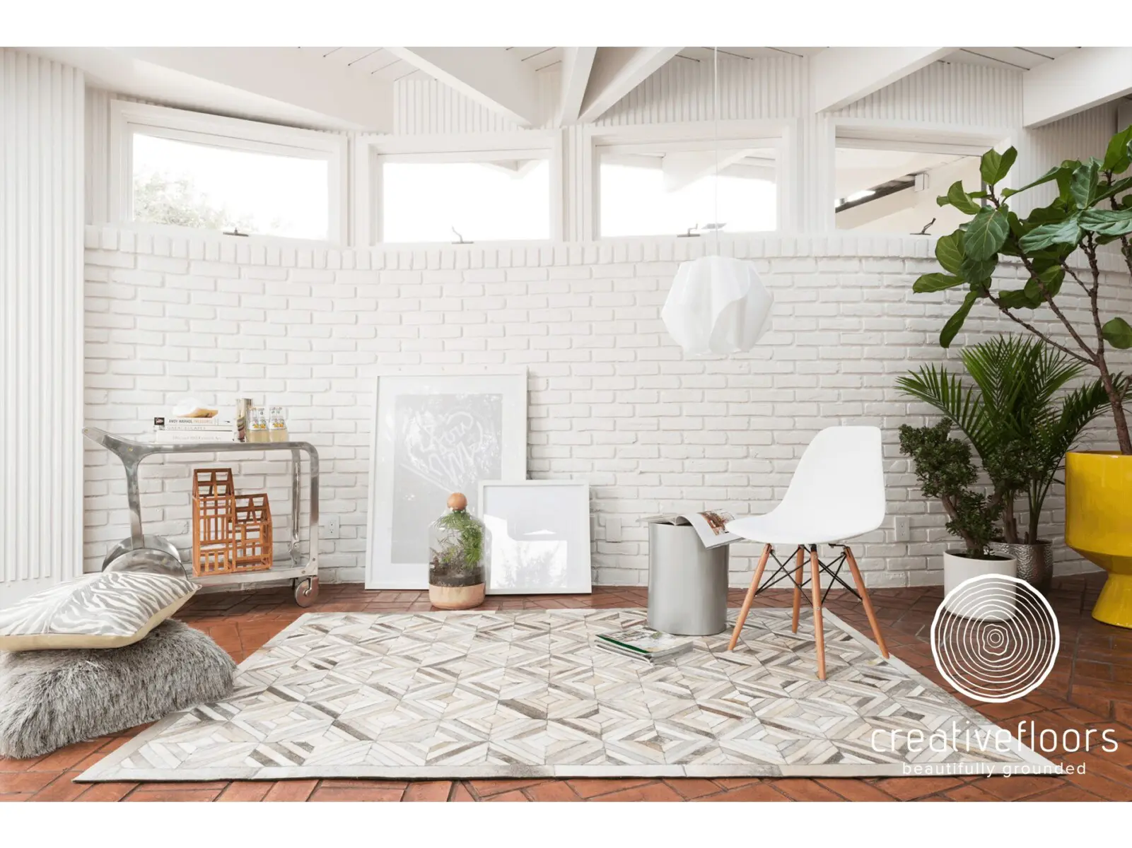 Vibrant indoor living space with white brick wall and patterned rug, perfect for modern home flooring.