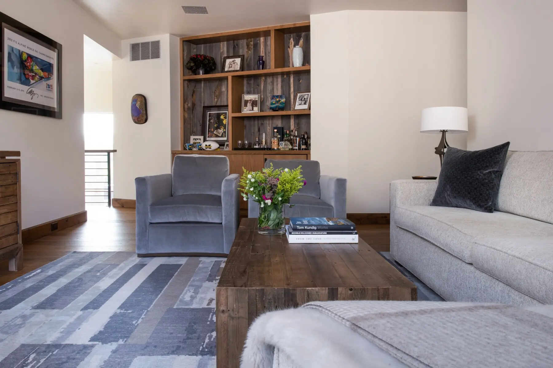 Cozy living room with stylish hardwood flooring, modern furniture, and decorative accents.