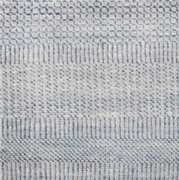 Soft textured carpet sample in neutral tones, ideal for enhancing home or office flooring with quality craftsmanship.