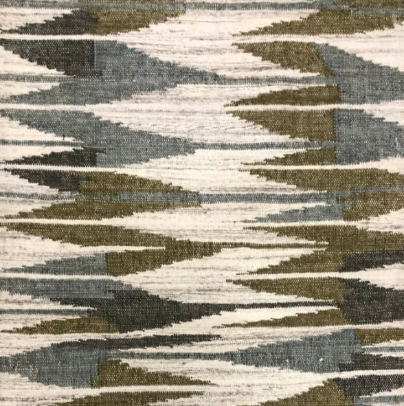 Modern geometric area rug with abstract patterns in neutral colors.