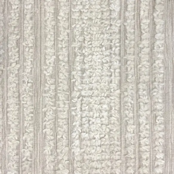 Cream textured carpet with boucle detail, ideal for modern interior flooring.