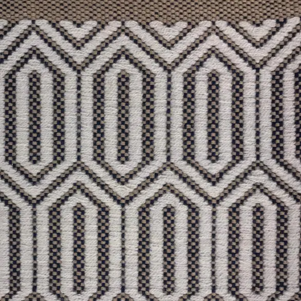 Intricate geometric patterned rug with neutral tones, perfect for stylish home flooring solutions.