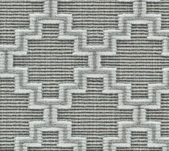 Soft textured rug with geometric pattern, ideal for modern interior flooring and home decor.