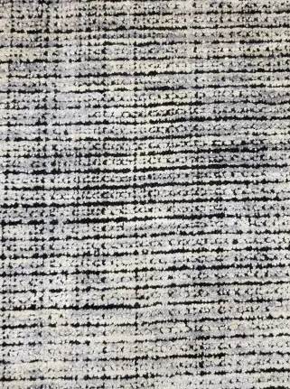 Textured modern carpet with neutral tones suitable for residential and commercial spaces.