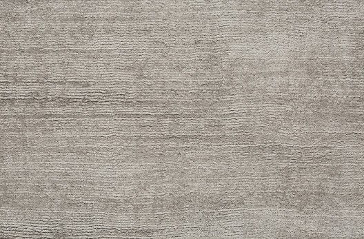 Weathered wood-textured hardwood flooring in neutral tones suitable for residential and commercial interiors, showcasing durable flooring options.