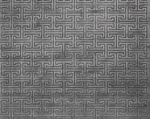 Intricate geometric gray carpet pattern for modern flooring designs.