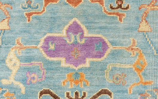 Colorful handmade rug showcasing vibrant patterns and intricate details for rich interior flooring.