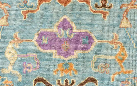 Colorful handmade rug showcasing vibrant patterns and intricate details for rich interior flooring.