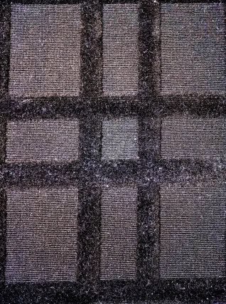 Textured plaid carpet with neutral tones, perfect for residential or commercial flooring solutions.