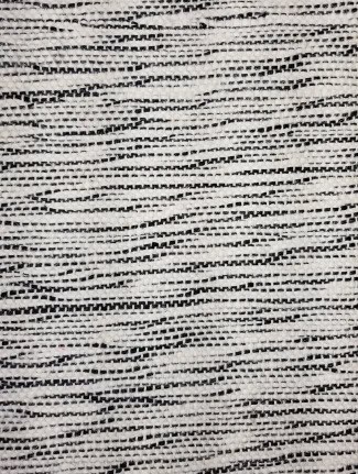 Mavis - LMI-BW-23 Textured black and white patterned flooring sample.