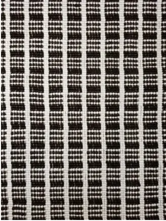 Colorful woven rug with geometric pattern for modern interior decor.