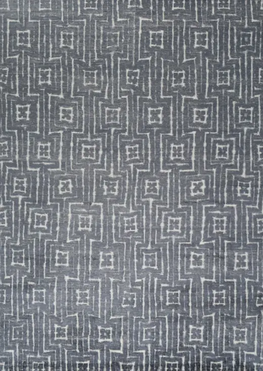 Luxurious gray and white geometric patterned area rug from Creative Floors, perfect for modern interior design.