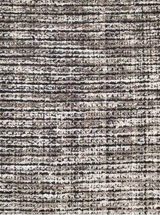 Soft beige and gray textured area rug with modern abstract pattern for living rooms or bedrooms.