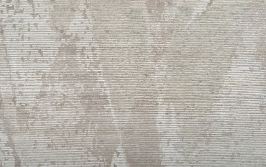 Elegant beige textured carpet with subtle patterns, ideal for stylish residential or commercial flooring.