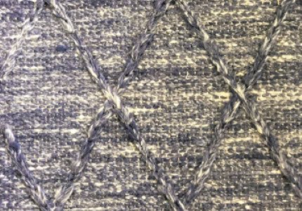 High-quality textured carpet with a tufted design for residential and commercial spaces.