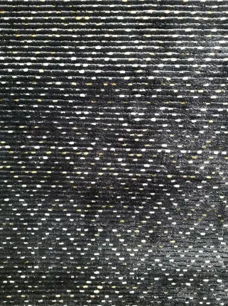 Glossy black and gold patterned flooring with intricate geometric design.