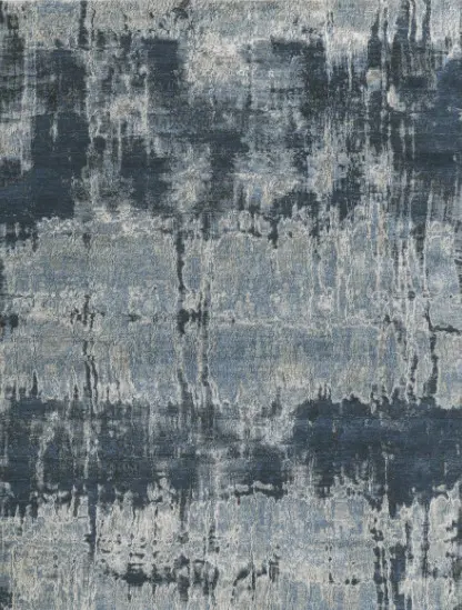 Vintage abstract rug in shades of blue and gray with a textured pattern, ideal for modern or contemporary living spaces.