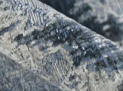 Textured gray rug with intricate patterns for living room decor.