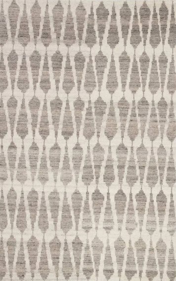 Patterned area rug with geometric design in neutral tones for modern home decor.