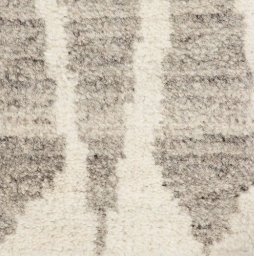 Cream and gray patterned area rug with textured design, ideal for modern living spaces.