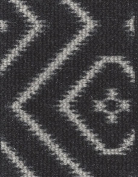 Black and white patterned carpet flooring with a zigzag design.
