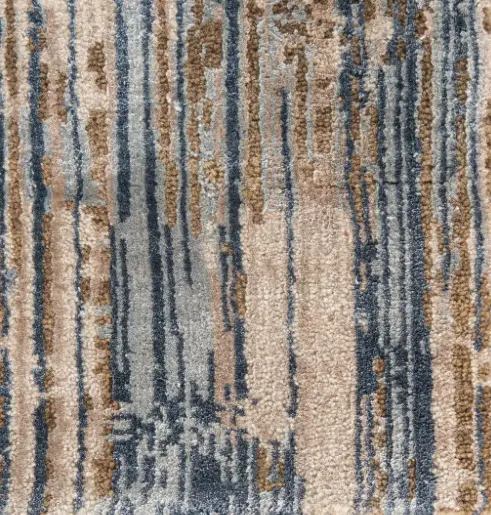 Plush patterned carpet with beige, blue, and gray tones for sophisticated interior flooring solutions.