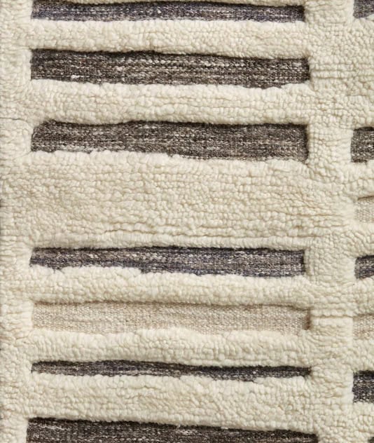 Soft beige and brown striped plush carpet, high-quality flooring for modern interior design.