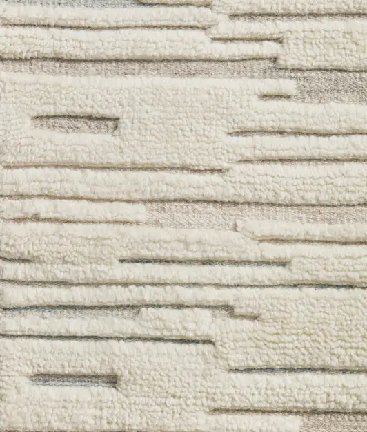 Cream textured modern carpet with linear pattern for stylish flooring.
