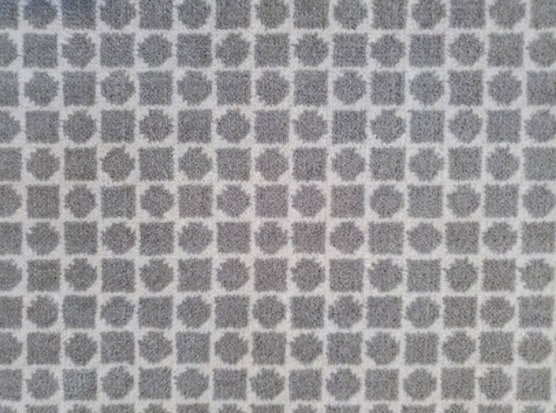 Patterned gray and white tile flooring design for modern interiors.