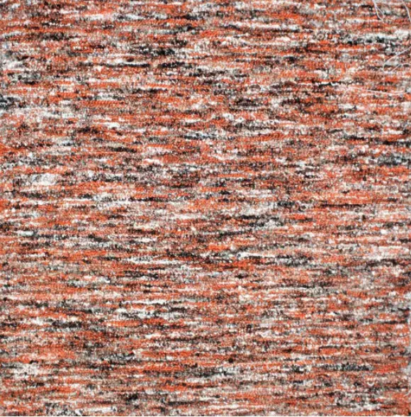 Colorful abstract textured carpet with vibrant red, black, and white tones, ideal for modern flooring designs.