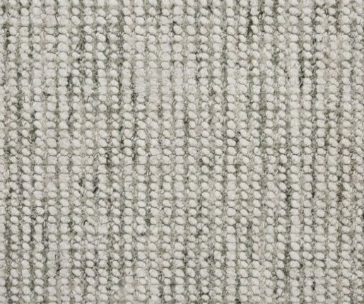 Soft beige textured carpet with loop pile, ideal for modern interior flooring.